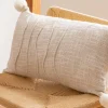 Coussin 30x50cm naturel pompons